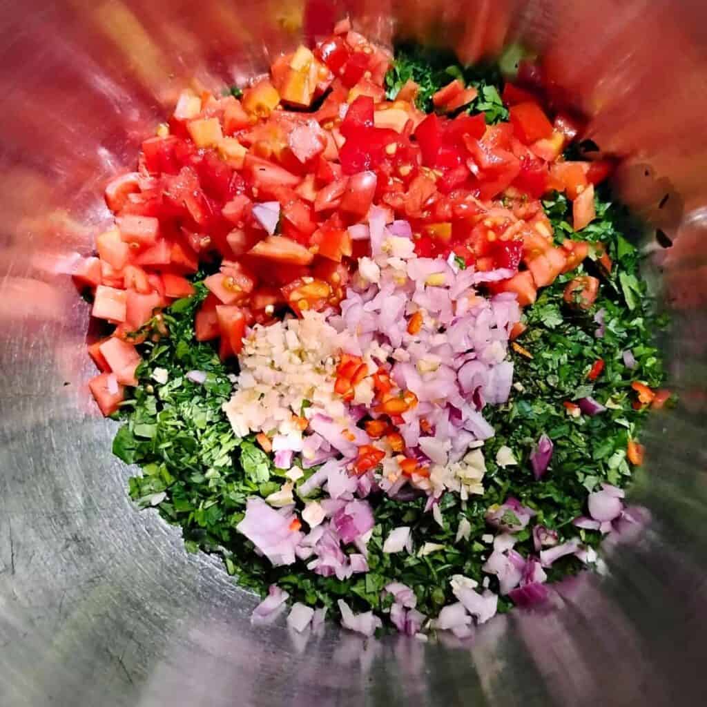 ingredients for tabouli salad in a bowl.