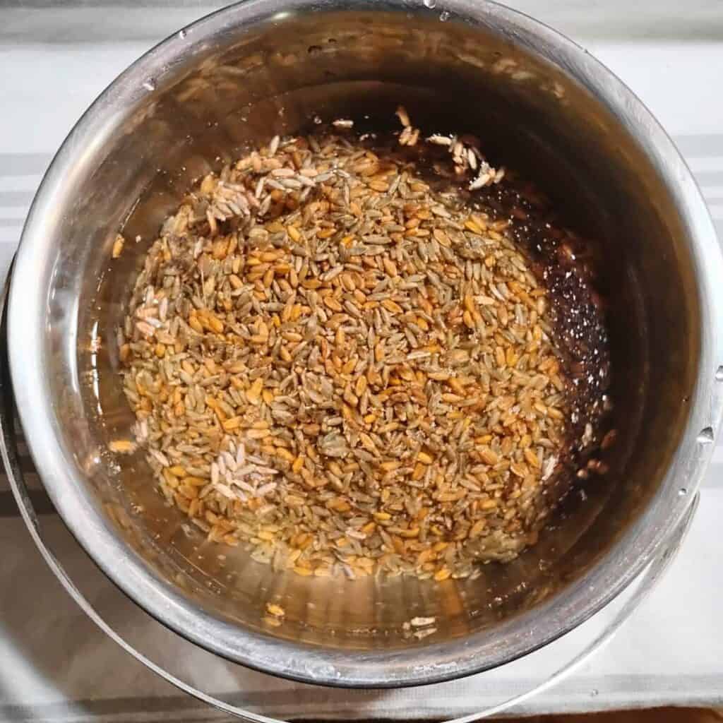 raw grains in a pot with water for soaking.