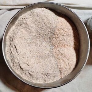 freshly milled rye and spelt flour in a bowl.
