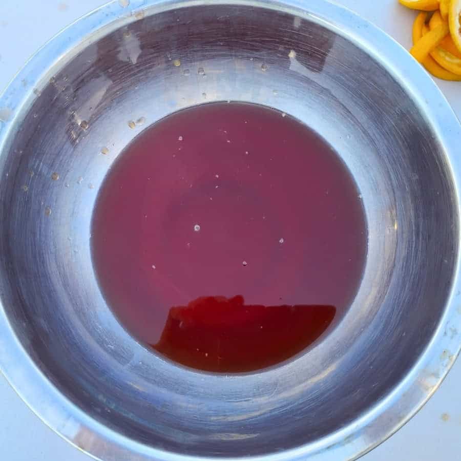 photo shows a bowl filled with mimosa flower syrup 